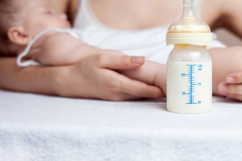Feeding bottle to baby